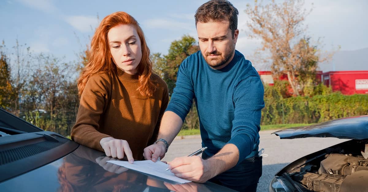 Exchanging insurance info after an accident.