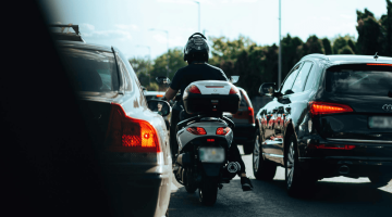 Biker lane splitting.