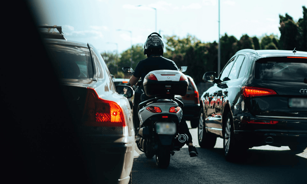 Biker lane splitting.